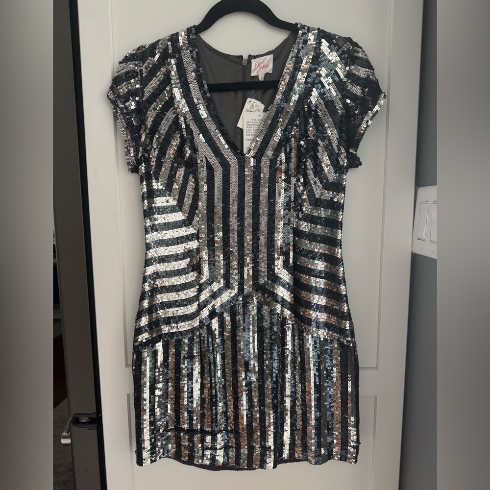 NWT black and silver sequin above the knee dress. V neck. Zipper back.
